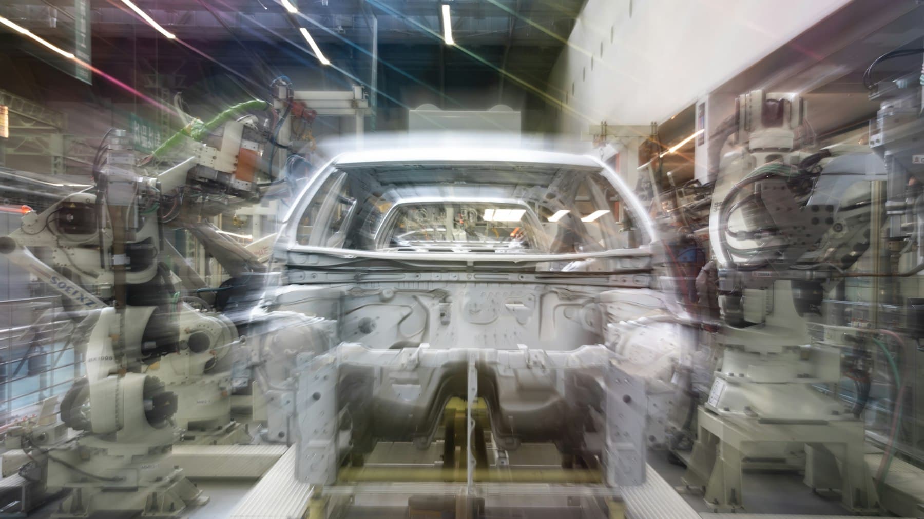 Robotic arms on a car assembly line