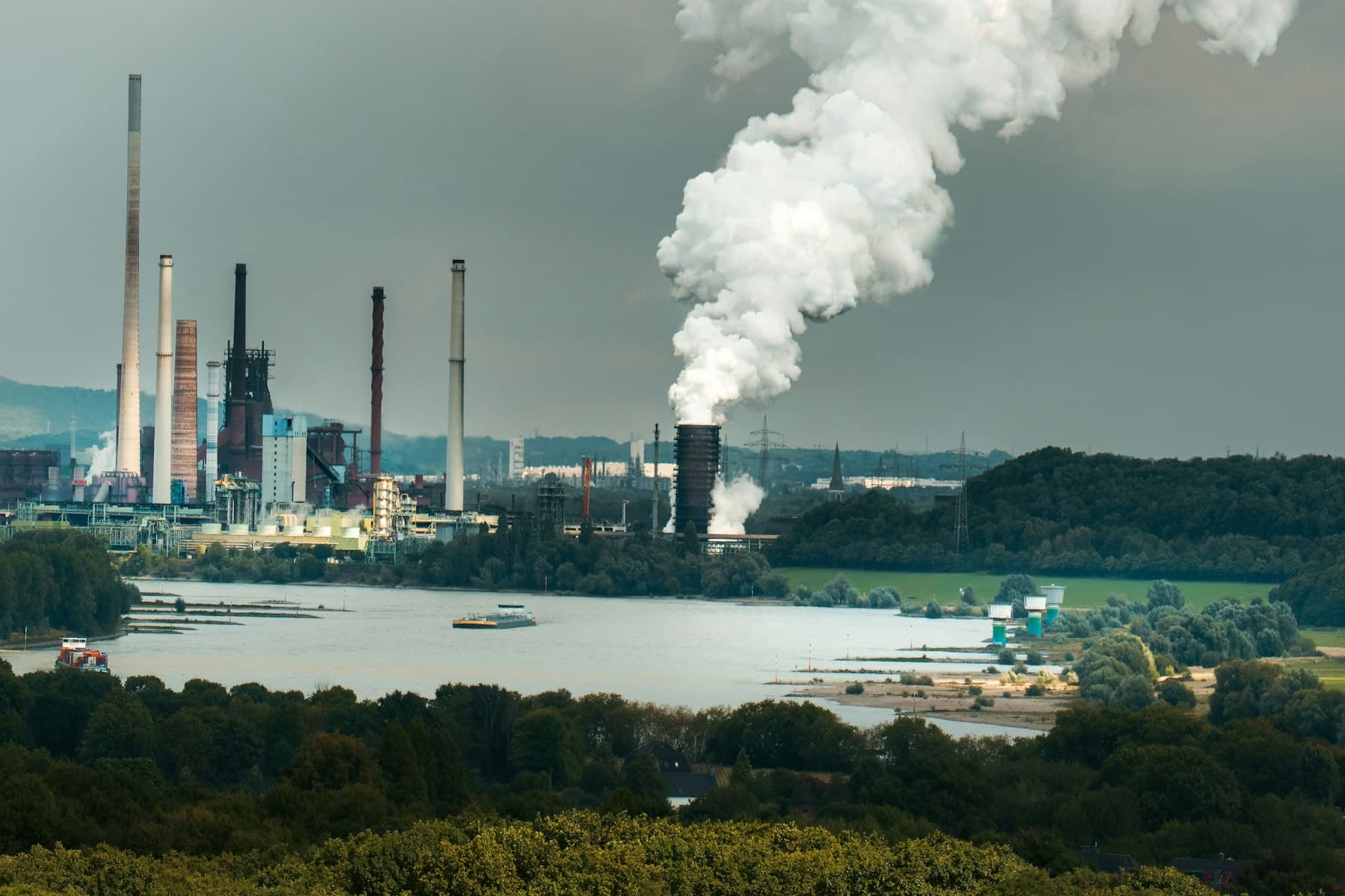 Industrial chemical plant with smoke stacks and processing towers