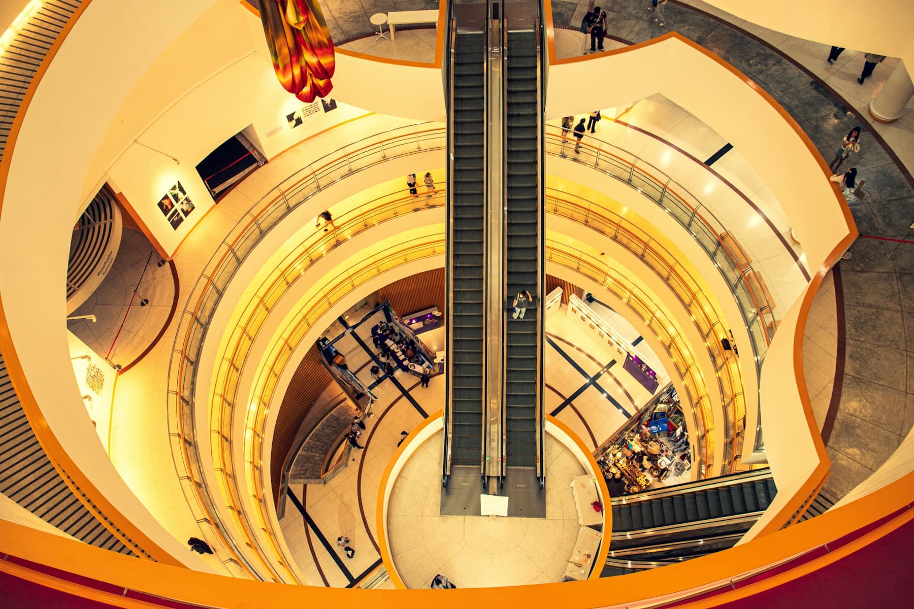 Multi level shopping mall atrium with escalators