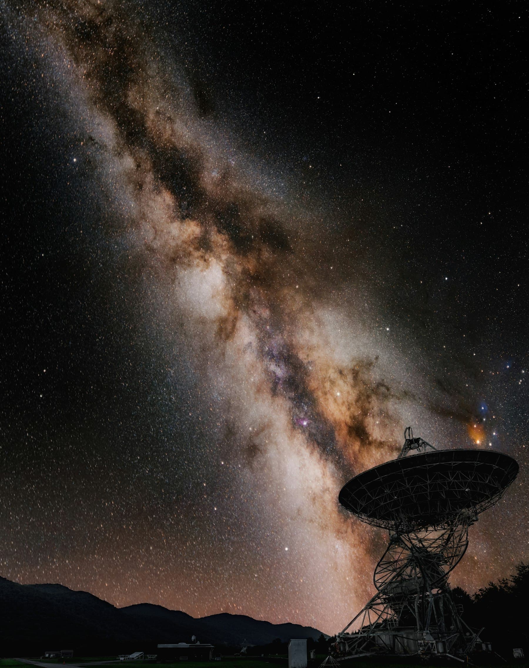 Large satellite dish with the Milky Way in the background