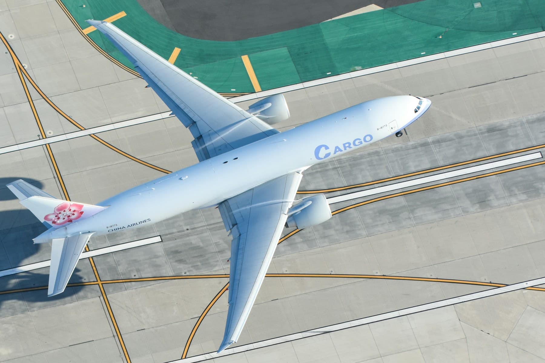 Cargo aircraft viewed from above on an airport taxiway