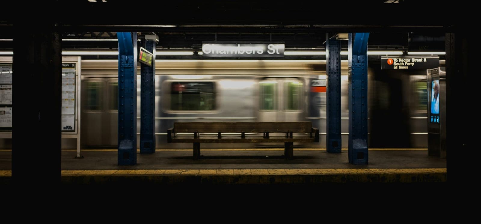 Metro train arriving at an underground station platform