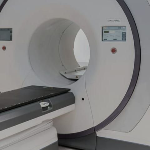 Imaging scanner bore and patient table in a hospital scanning room